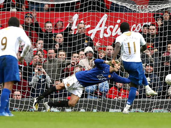 Sulley Muntari scores from the spot for Pompey at Manchester United.