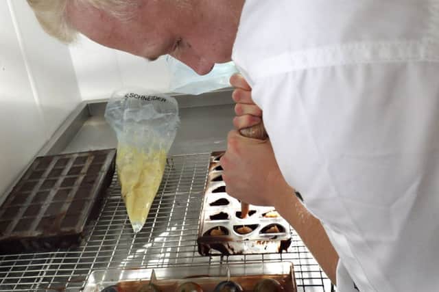 Samuel Sewell piping the chocolates. Picture by LPhot Louise George