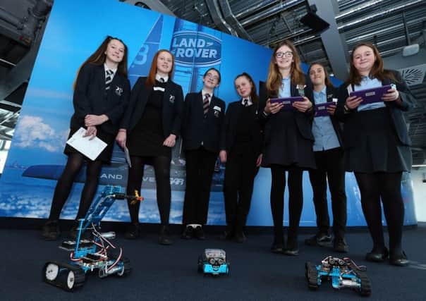 Girls control robots from the Faculty of Technology at the University of Portsmouth.  Picture: Chris Moorhouse