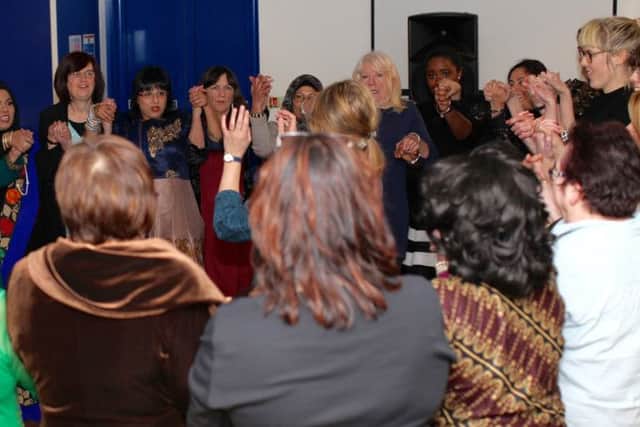 Circle dancing at Fratton Park for International Women's Day