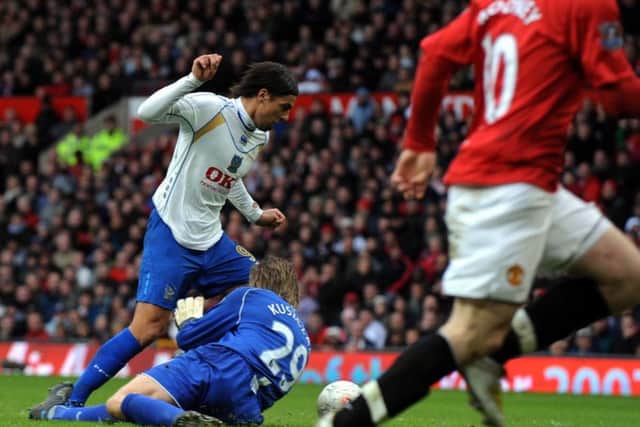 United keeper Tomasz Kuszczak brings down Milan Baros for the penalty. Picture: Steve Reid
