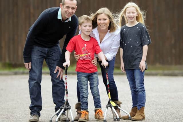 Oliver Osborne pictured with his family (from left), dad Terry, mum Sallyanne and sister Millie. Picture by Malcolm Wells