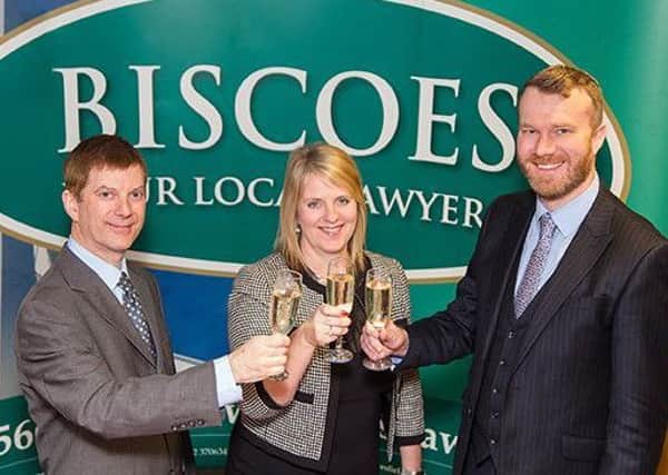 The Biscoes team celebrates a double merger