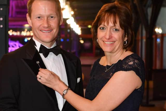 Darren Cooper accepting his award from Volkswagen MD, Alison Jones