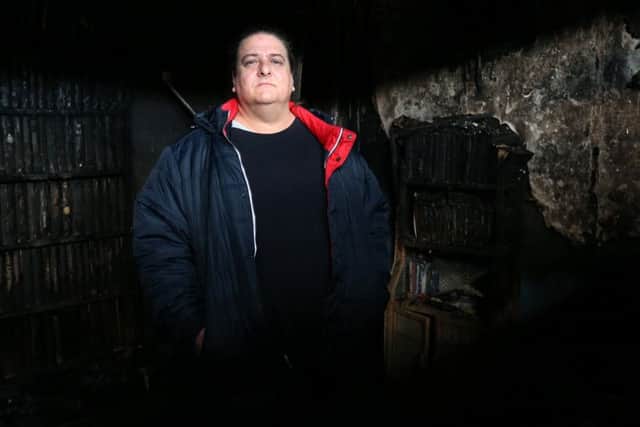 Paul Fewings in what was the living room, after the fire at his flat in New Road, Buckland Picture: Chris Moorhouse