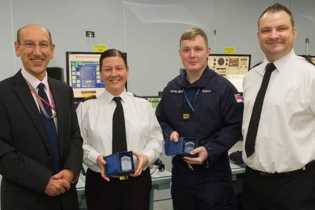 The 10,000th trainee passes through the MCTS training facility at HMS Collingwood. Ian Carter, BAE Systems Training Delivery Manager, PO(WS) Amanda Tinson, the first person to complete her training in MCTS, AB(WS) Matthew North, the 10,000th and WO1 Dean Button