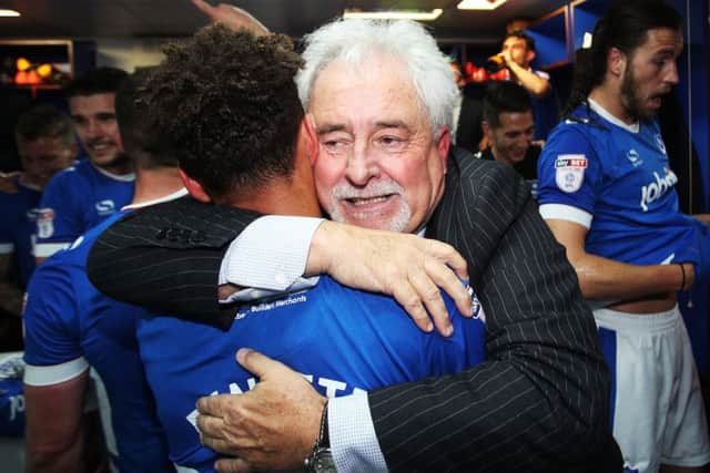 Former Pompey chairman Iain McInnes celebrates Pompeys League Two title success with a hug for Kyle Bennett Picture: Joe Pepler