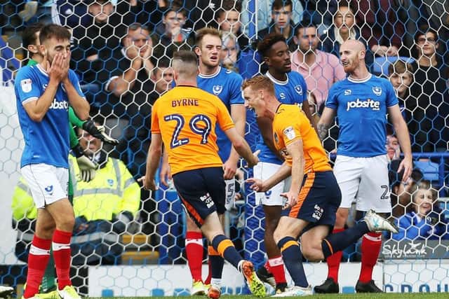 Former Pompey loanee Eoin Doyle scores for Oldham at Fratton Park. Picture: Joe Pepler