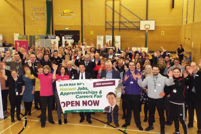 MP Alan Mak, centre, celebrates his jobs fair success with students, entrepreneurs and workers for scores of firms