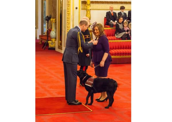 Lisa Baldock from Fratton is made an MBE by the Duke of Cambridge at Buckingham Palace Picture: Dominic Lipinski/PA Wire