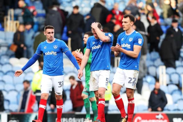 Brandon Haunstrup, left, Matt Clarke, centre, and Kal Naismith after Pompey's loss to Gillingham. Picture: Joe Pepler