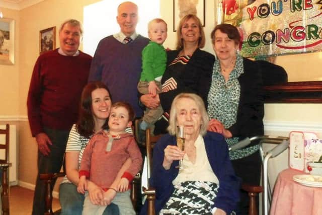 Violet Pidgeon surrounded by her family on her 105th birthday