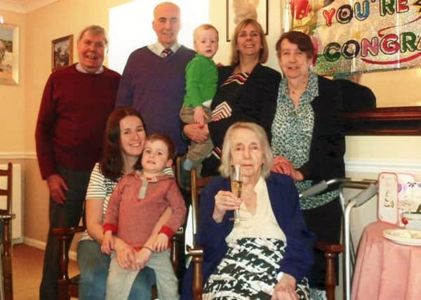 Violet Pidgeon surrounded by her family on her 105th birthday