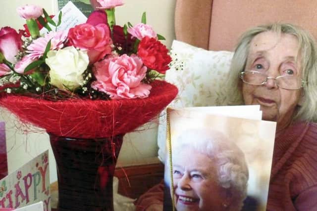 Violet is delighted with her telagram from the Queen