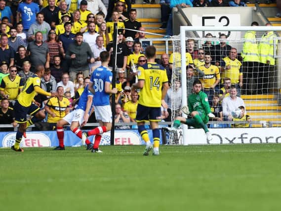 Gino van Kessel scores for Oxford United in their 3-0 win over Pompey in August. Picture: Joe Pepler