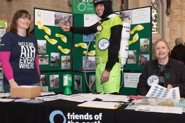 Members of the Portsmouth Friends of the Earth at their stand tackling the quality of air in Portsmouth. Jane Di Dino, Paul Hinchliffe and Janice Attrill   Picture: Keith Woodland