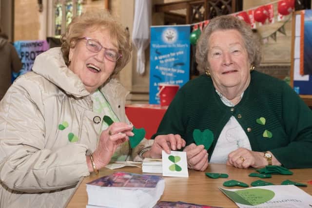 Joyce Fitzjohn and Shirley Rudder handed out green hearts and heart-shaped stickers to share        Picture: Keith Woodland