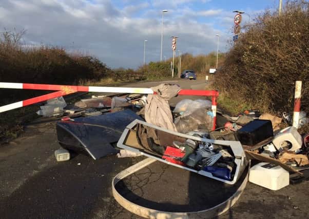 Rubbish has been flytipped at the top of Gillman Road where it meets Portsdown Hill Road, blocking pedestrian and cyclist access.