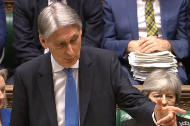 Chancellor of the Exchequer Philip Hammond, gestures, as he delivers his first spring statement in the House of Commons