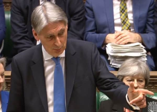Chancellor of the Exchequer Philip Hammond, gestures, as he delivers his first spring statement in the House of Commons