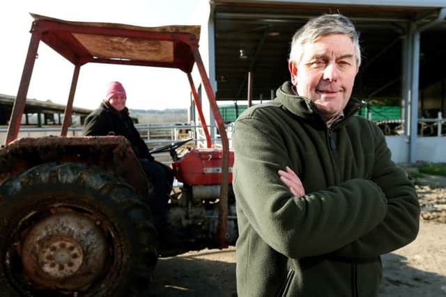 Hampshire NFU chairman Andrew Malyon, dairy farmer, pictured with his daughter, Sarah, at his farm, Goathouse Farm, North Boarhunt, Fareham. Picture: Chris Moorhouse