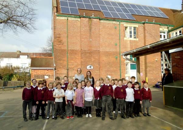 Pupils at Southsea Infant School with their solar panels