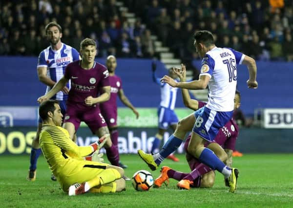 Gary Roberts goes through on goal for Wigan in their FA Cup win against Manchester City. Picture: PA Images