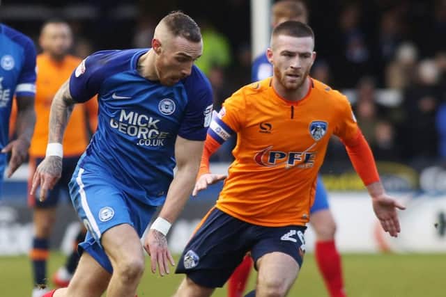 Jack Byrne, right, in action for Oldham against Peterborough United Picture: Joe Dent
