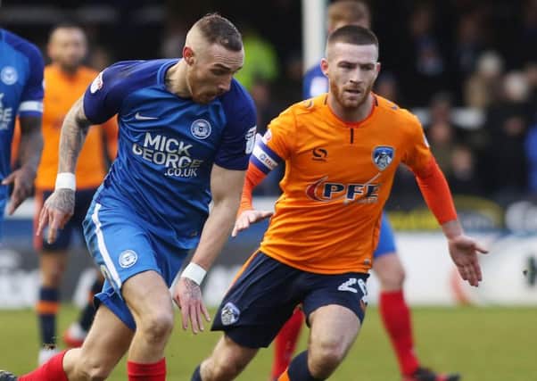 Jack Byrne, right,  in action for Oldham against Peterborough United Picture: Joe Dent