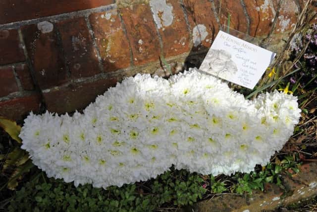 A moustache-themed floral tribute at Geoff White's funeral