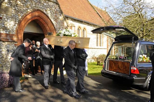 The coffin of Geoff White leaves All Saint's Church in Denmead