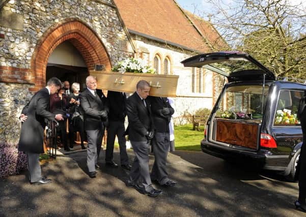The coffin of Geoff White leaves All Saint's Church in Denmead