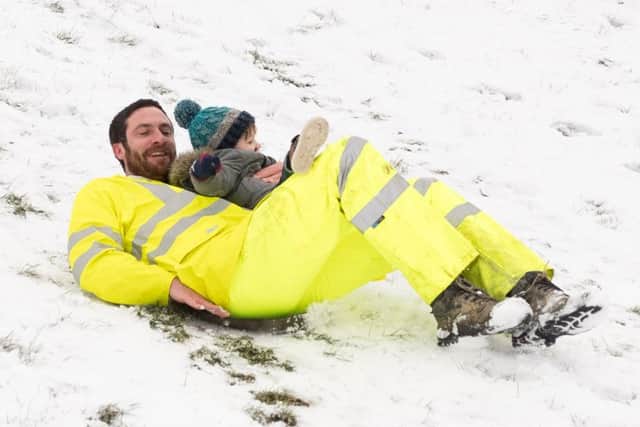 Jake and Maverick Gofton enjoy the snow together in Southsea.