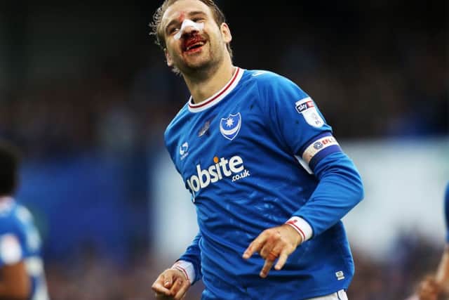 Brett Pitman sports a bloodied nose after scoring against Fleetwood in September