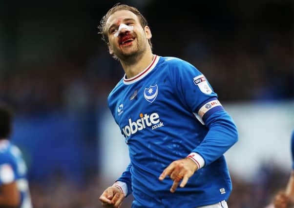 Brett Pitman sports a bloodied nose after scoring against Fleetwood in September