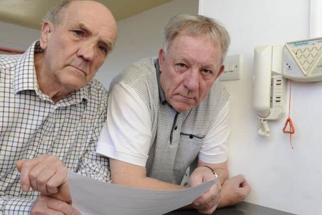 Residents at Spring Court in Lee-on-the-Solent are angry after being told by their management company that they are each going to have to pay £800 to have new individual pull cords installed. Residents Michael Chapman and David Heather.
Picture Ian Hargreaves (180215-1)