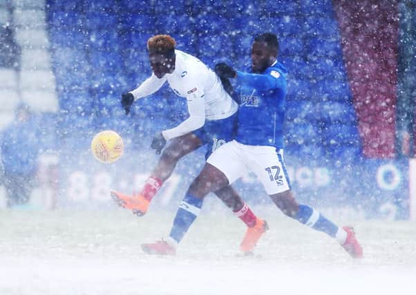 Pompey boss Kenny Jackett has praised his side for battling the snow and securing a 2-0 win at Oldham. Picture: Joe Pepler/Digital South