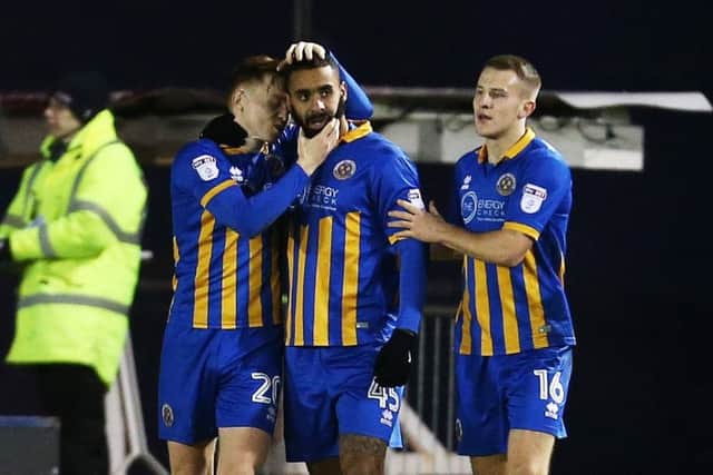 Stefan Payne, centre, netted Shrewsbury's winner at Scunthorpe. Picture: Joe Pepler