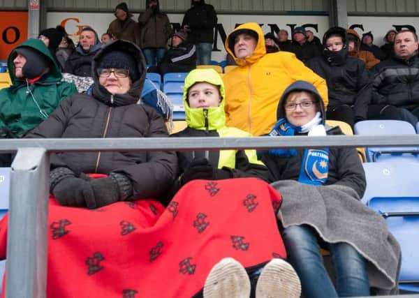 Hawks supporters were wrapped up on a chilly afternoon. Picture: Duncan Shepherd