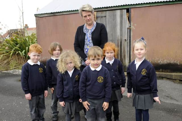 Teacher Karen Dight with just some of the disappointed children who will now be deprived of the chance to learn to cycle at St Mary's Catholic School in Anns Hill Road, Gosport Picture by: Malcolm Wells (180313-0311