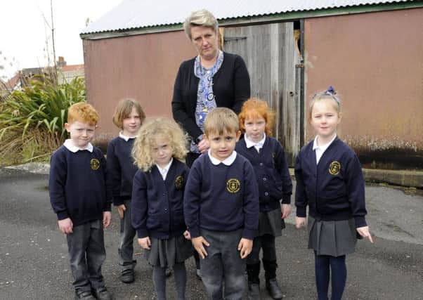 Teacher Karen Dight with just some of the disappointed children who will now be deprived of the chance to learn to cycle at St Mary's Catholic School in Anns Hill Road, Gosport Picture by:  Malcolm Wells (180313-0311