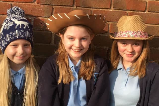 Megan Piper, centre, whose father Stuart has a brain tumour with her friends at Elson Junior School