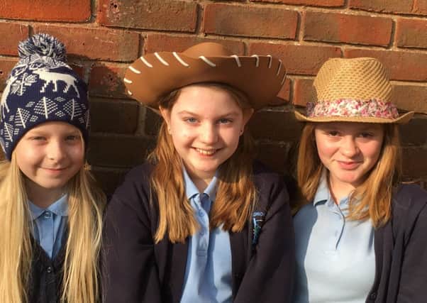 Megan Piper, centre, whose father Stuart has a brain tumour with her friends at Elson Junior School