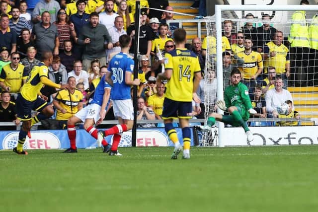 Gino van Kessel scores for Oxford United in their 3-0 win over Pompey in August. Picture: Joe Pepler