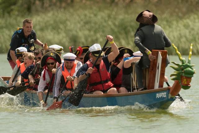 City councillors paddle to victory as Nelson's Heroes at last year's dragon boat festival in Portsmouth Picture: Keith Woodland