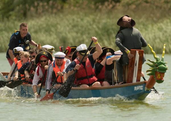 City councillors paddle to victory as Nelson's Heroes at last year's dragon boat festival in Portsmouth Picture: Keith Woodland