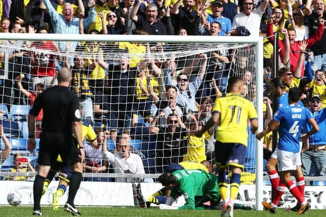 Wes Thomas scores for Oxford against Pompey earlier this season. Picture: Joe Pepler