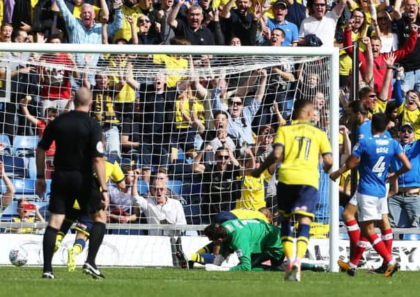Wes Thomas scores for Oxford against Pompey earlier this season. Picture: Joe Pepler