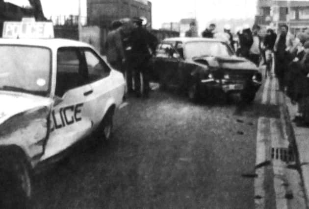 Police officers gather information at The Hard. Portsea, after a police chase