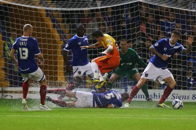 Pompey defend before their clash with Wycombe in 2013 is abandoned. Picture: Joe Pepler